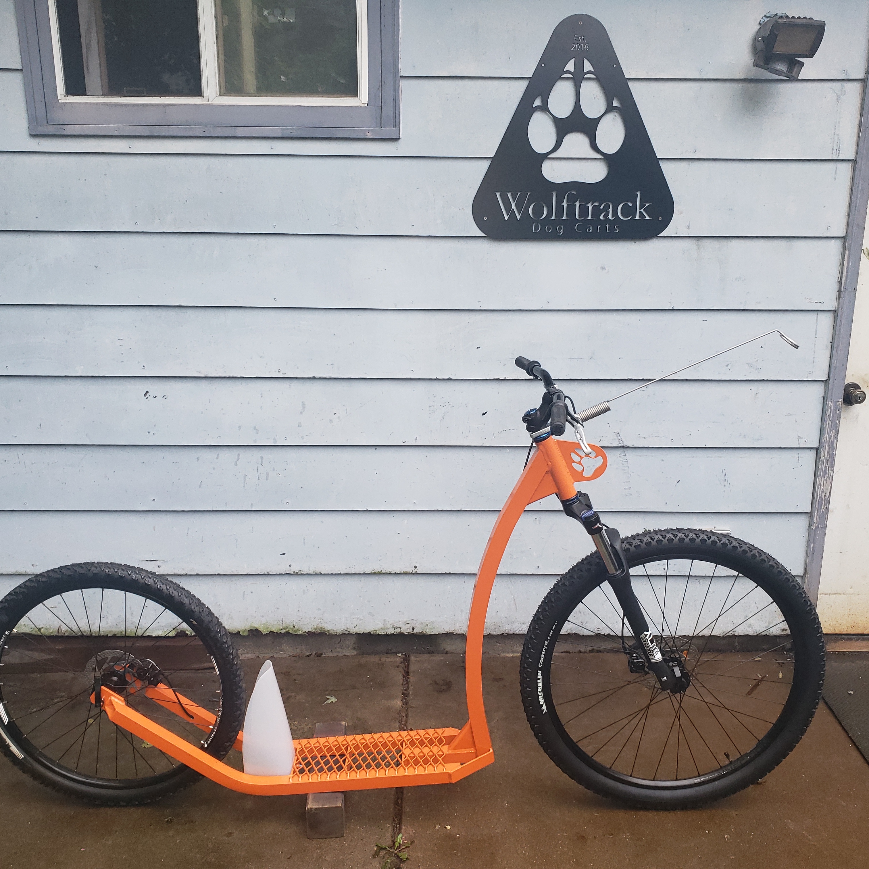 Orange 2 wheel scooter