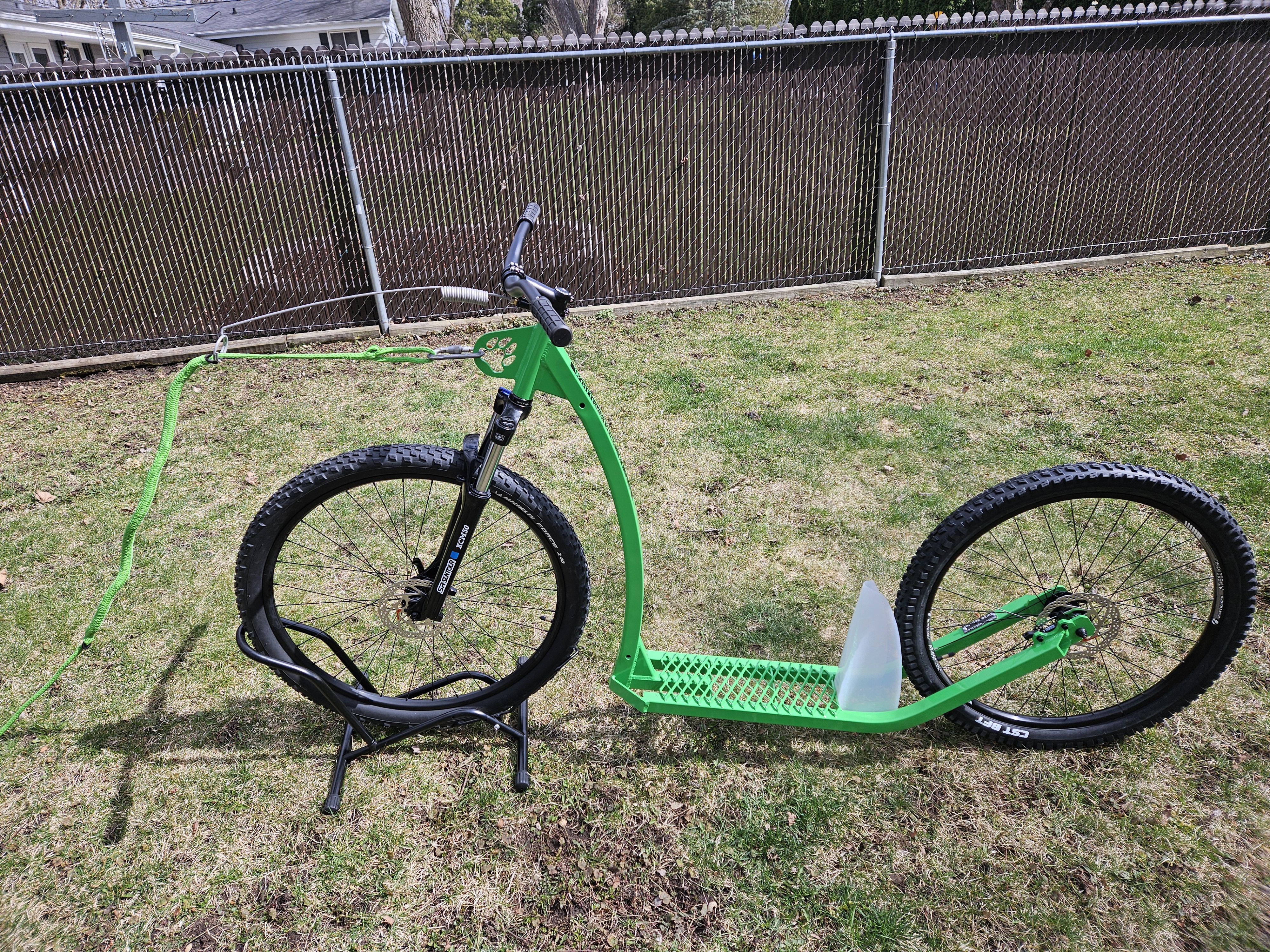 Green scooter on grass